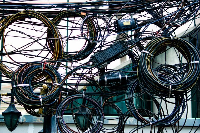 Tangled cables symbolising the hidden financial risks of missing HR basics