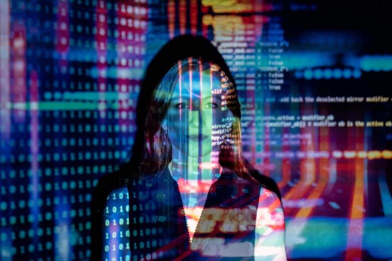 Human figure overlaid with computer code and data projections, symbolising the connection between HR and AI.